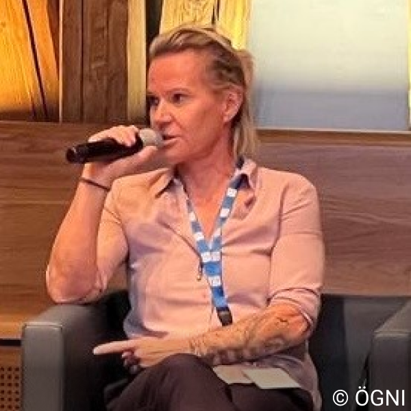 Technical Board Member Petra Kuehnel speaking into a microphone.